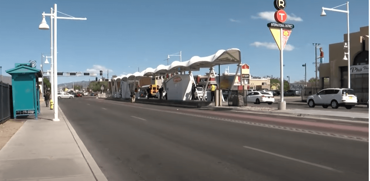 Public transit stop with ART sign in center of median